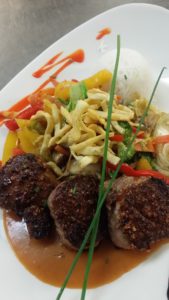 Thai spiced roasted Porktenderloin medallions with Wok vegetables & Thai Curry sauce